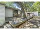 Enjoy the beautiful backyard from the wood deck with table and chairs under the shade of mature trees at 2425 Park St., North Myrtle Beach, SC 29582