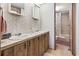 Bathroom features a double sink vanity and shower-tub combination at 2425 Park St., North Myrtle Beach, SC 29582