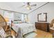This bedroom offers natural light, ceiling fan, and wood-look floors at 2425 Park St., North Myrtle Beach, SC 29582