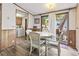Bright dining area with sliding glass door, access to the laundry area, and plenty of natural light at 2425 Park St., North Myrtle Beach, SC 29582