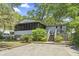 Charming home featuring a cozy porch, outdoor stairs, and well-maintained landscaping at 2425 Park St., North Myrtle Beach, SC 29582