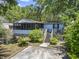 Quaint home with an inviting porch, steps, and established greenery, offering charm and curb appeal at 2425 Park St., North Myrtle Beach, SC 29582