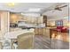 Bright eat-in kitchen featuring wood cabinets and newer flooring, open to the living area at 2425 Park St., North Myrtle Beach, SC 29582