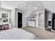Bedroom featuring modern decor, a vanity, and a TV, creating a relaxing and stylish space at 2441 Hunters Trail, Myrtle Beach, SC 29588