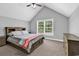 Bedroom with neutral colors, lots of natural light, vaulted ceilings, and lots of storage space at 2441 Hunters Trail, Myrtle Beach, SC 29588