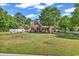 Charming brick home featuring a well-manicured lawn and mature trees offering great curb appeal at 2441 Hunters Trail, Myrtle Beach, SC 29588