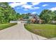 Beautiful brick home with manicured lawn, long driveway, and well-maintained landscaping, offering curb appeal and charm at 2441 Hunters Trail, Myrtle Beach, SC 29588