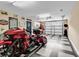 Organized garage featuring a motorcycle, black and white tiled floor, and storage solutions at 2441 Hunters Trail, Myrtle Beach, SC 29588