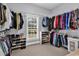 Organized walk-in closet with shelving and hanging rods, offering plenty of space for clothing and accessories at 2441 Hunters Trail, Myrtle Beach, SC 29588