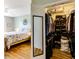 Bedroom with hardwood floors that leads to a walk-in closet with custom shelving at 260 Woodlands Way # 2, Calabash, NC 28467