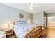 Bedroom featuring hardwood floors and a full-sized bed with a floral comforter at 260 Woodlands Way # 2, Calabash, NC 28467