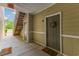 Hallway view featuring exterior door, staircase, and neutral color palette at 260 Woodlands Way # 2, Calabash, NC 28467