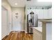 Bright kitchen with stainless steel appliances, wood-look floors, and white cabinetry at 260 Woodlands Way # 2, Calabash, NC 28467