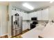 Modern kitchen featuring stainless steel appliances, white cabinets, and ample counter space at 260 Woodlands Way # 2, Calabash, NC 28467