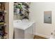 Practical laundry room with white washer and dryer, wire shelving stocked with cleaning supplies at 260 Woodlands Way # 2, Calabash, NC 28467