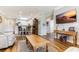 Spacious living area showcasing an open layout, hardwood floors, and a flat-screen television at 260 Woodlands Way # 2, Calabash, NC 28467