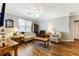 Bright and airy living room with hardwood floors, neutral walls, and plenty of natural light at 260 Woodlands Way # 2, Calabash, NC 28467