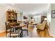 Open concept living area flows from kitchen to dining room and features hard surface floors at 260 Woodlands Way # 2, Calabash, NC 28467
