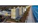 An aerial view of a beachfront resort with pools, parking garage, and multiple high-rise buildings along a sandy coastline at 2701 S Ocean Blvd. # 902, North Myrtle Beach, SC 29582
