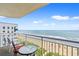 Balcony view overlooking the sunny beach and crystal-clear ocean waters at 2701 S Ocean Blvd. # 902, North Myrtle Beach, SC 29582