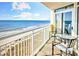 A balcony with seating that overlooks the scenic views of the ocean and beach at 2701 S Ocean Blvd. # 902, North Myrtle Beach, SC 29582