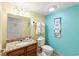 Bright bathroom featuring a single sink vanity, toilet, and colorful decor at 2701 S Ocean Blvd. # 902, North Myrtle Beach, SC 29582