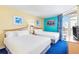 Bright bedroom with two queen beds, blue accent wall, and balcony access at 2701 S Ocean Blvd. # 902, North Myrtle Beach, SC 29582