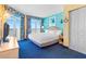 Bright bedroom with a king bed, balcony access, and ocean views at 2701 S Ocean Blvd. # 902, North Myrtle Beach, SC 29582