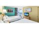 Comfortable bedroom featuring two beds, balcony access, and a flat-screen TV at 2701 S Ocean Blvd. # 902, North Myrtle Beach, SC 29582