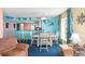 A colorful dining room with coastal decor featuring a dining table set for six and an adjacent bar area at 2701 S Ocean Blvd. # 902, North Myrtle Beach, SC 29582