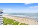 A beautiful ocean view from the unit, with a sandy beach and clear blue water at 2701 S Ocean Blvd. # 902, North Myrtle Beach, SC 29582