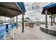 Spacious outdoor patio area featuring tables, chairs, and umbrellas, ideal for dining and enjoying ocean breezes at 2701 S Ocean Blvd. # 902, North Myrtle Beach, SC 29582
