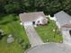 Aerial view of a well maintained single-Gathering home with a lush green lawn and mature trees in a cul-de-sac at 271 Sienna Dr., Little River, SC 29566