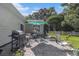 Stone patio with an outdoor kitchen featuring a grill and outdoor seating at 271 Sienna Dr., Little River, SC 29566
