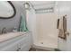 Bathroom featuring a white vanity and shower with glass block window at 271 Sienna Dr., Little River, SC 29566