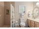Well-lit bathroom with a tiled shower, modern fixtures, and decorative accents creates a fresh, clean space at 271 Sienna Dr., Little River, SC 29566