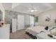 Comfortable bedroom boasts a textured accent wall, ample closet space, and a ceiling fan at 271 Sienna Dr., Little River, SC 29566