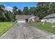 Well-maintained single-story home with a manicured lawn, front yard landscaping, and an attached garage at 271 Sienna Dr., Little River, SC 29566