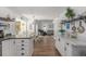 Open-concept kitchen with granite countertops leads to the dining and living area, offering a spacious layout at 271 Sienna Dr., Little River, SC 29566