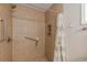 Walk-in shower featuring tile surround, grab bars, and shower curtain at 271 Sienna Dr., Little River, SC 29566