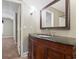 Bathroom with a wood vanity and a view to the hall and shower at 2712 Austin Ave., Conway, SC 29527