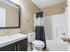 Bathroom featuring a vanity, toilet, and shower-tub combination with curtain at 2712 Austin Ave., Conway, SC 29527