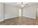 Bright bedroom features luxury vinyl plank flooring, neutral paint, and ceiling fan at 2712 Austin Ave., Conway, SC 29527