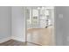 View into the bright kitchen with white cabinets and a window overlooking the front yard at 2712 Austin Ave., Conway, SC 29527