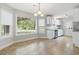Cozy kitchen with white cabinets, tile floors, stainless steel appliances, and eat in nook at 2712 Austin Ave., Conway, SC 29527