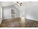 Bright living room with high ceilings, ceiling fan, wood floors, and built-in shelving at 2712 Austin Ave., Conway, SC 29527