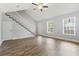 Spacious living room with a vaulted ceiling, staircase, wood floors, and natural light at 2712 Austin Ave., Conway, SC 29527