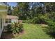 Secluded backyard showcasing a well-maintained lawn and lush landscaping at 2768 Temperance Dr., Myrtle Beach, SC 29577