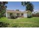 Well-maintained backyard with lush green grass, a small patio area, and privacy provided by mature trees at 2768 Temperance Dr., Myrtle Beach, SC 29577