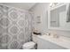 Cozy bathroom featuring decorative shower curtain, vanity, and a framed mirror at 2768 Temperance Dr., Myrtle Beach, SC 29577
